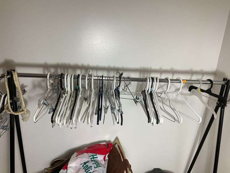 Clothes Hanging Rack, Clothes Hangers, Trash Can, Chair with Contents