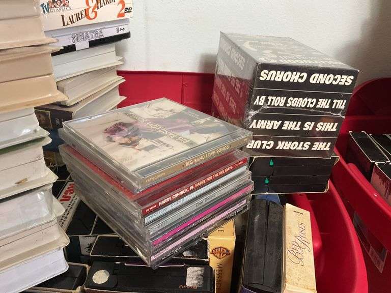 Assortment of VHS Tapes and CDs