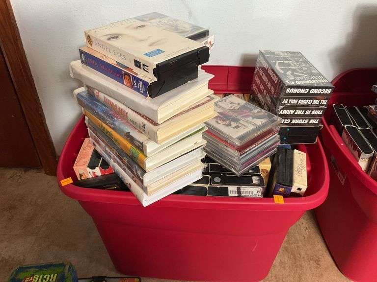 Assortment of VHS Tapes and CDs