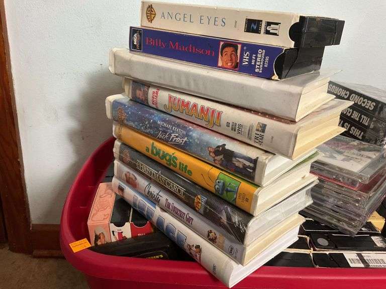 Assortment of VHS Tapes and CDs