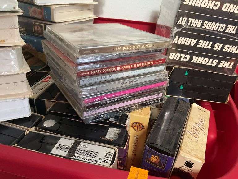 Assortment of VHS Tapes and CDs