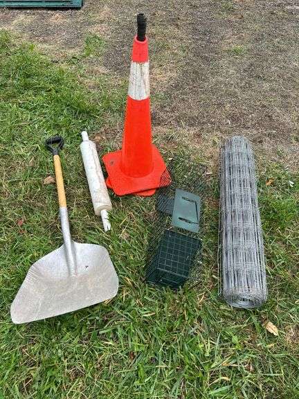 Road cones, live animal trap, wiring, scoop shovel and plastic wrap