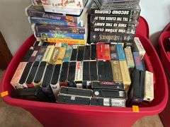 Assortment of VHS Tapes and CDs