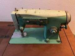 Vintage White Sewing Machine in Cabinet