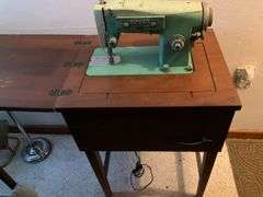Vintage White Sewing Machine in Cabinet