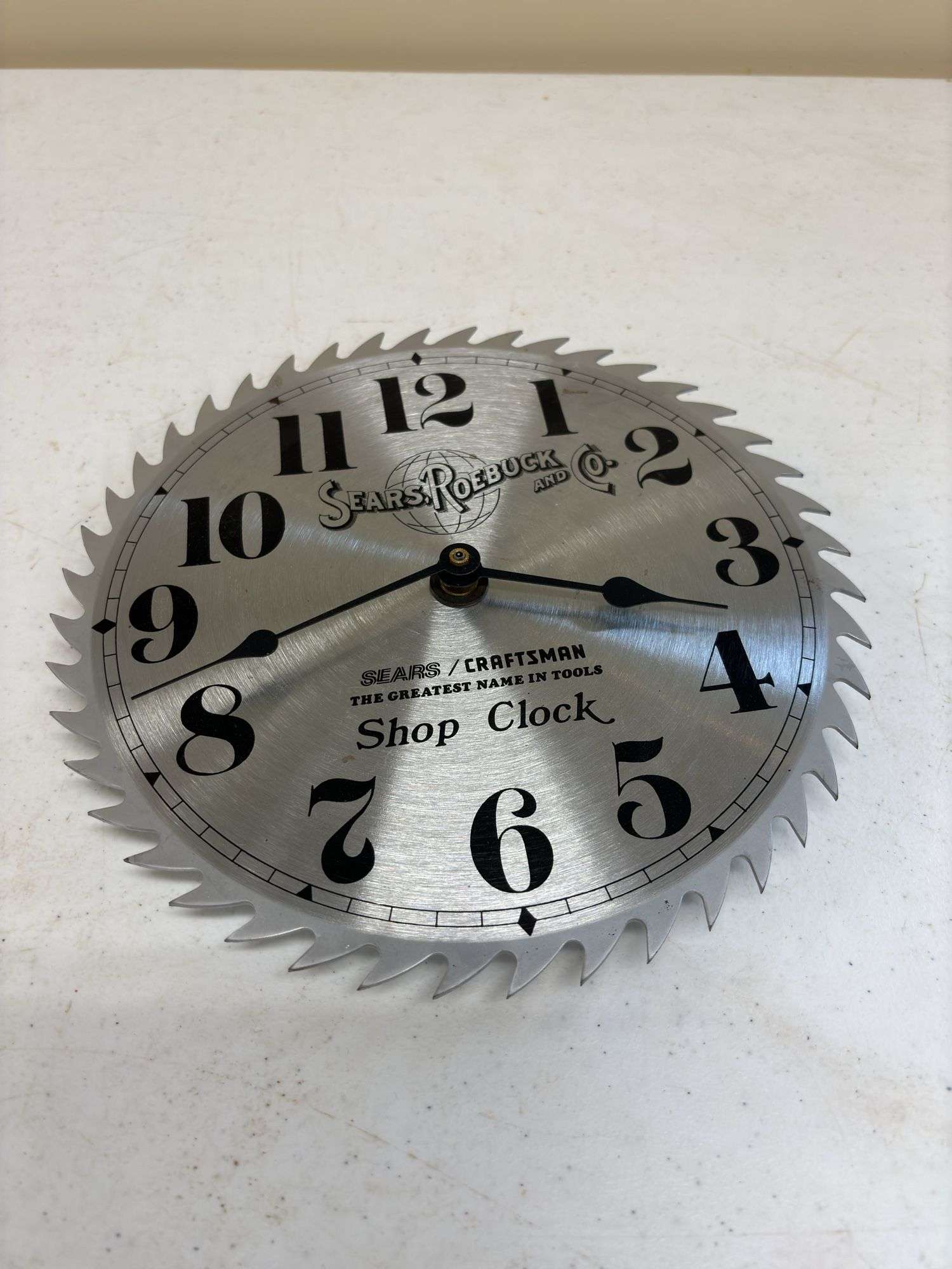 Sears Roebuck saw blade clock - Kaufman Realty & Auctions