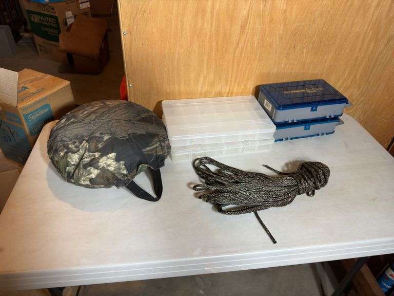 Camo round pillow, rope, and plastic cases.