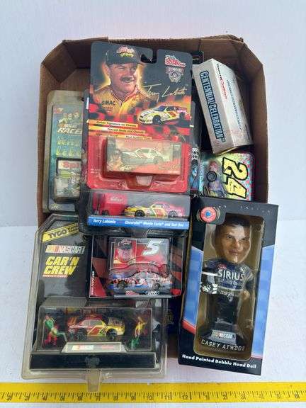 Assortment of NASCAR Toy Cars and Figurines
