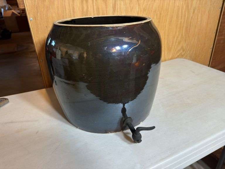 Glaze brown croc with spout and no lid.