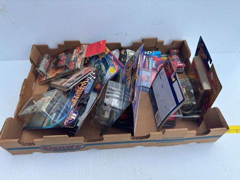 Assortment of NASCAR Toy Cars and Figurines