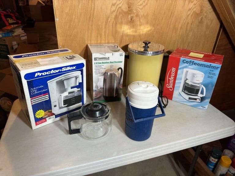 Various electric coffee makers and Igloo water jug.