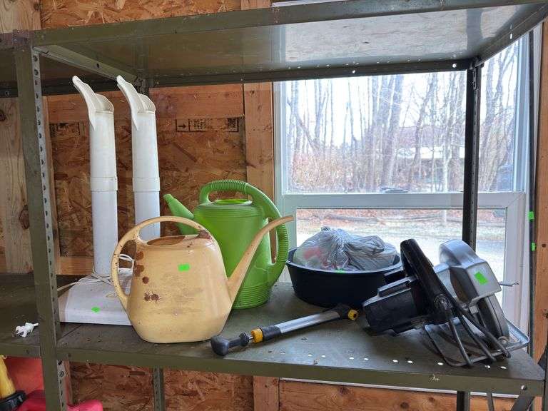 Contents of shelf saw and watering cans