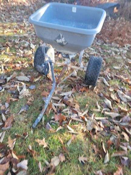 Rigid pull behind spreader