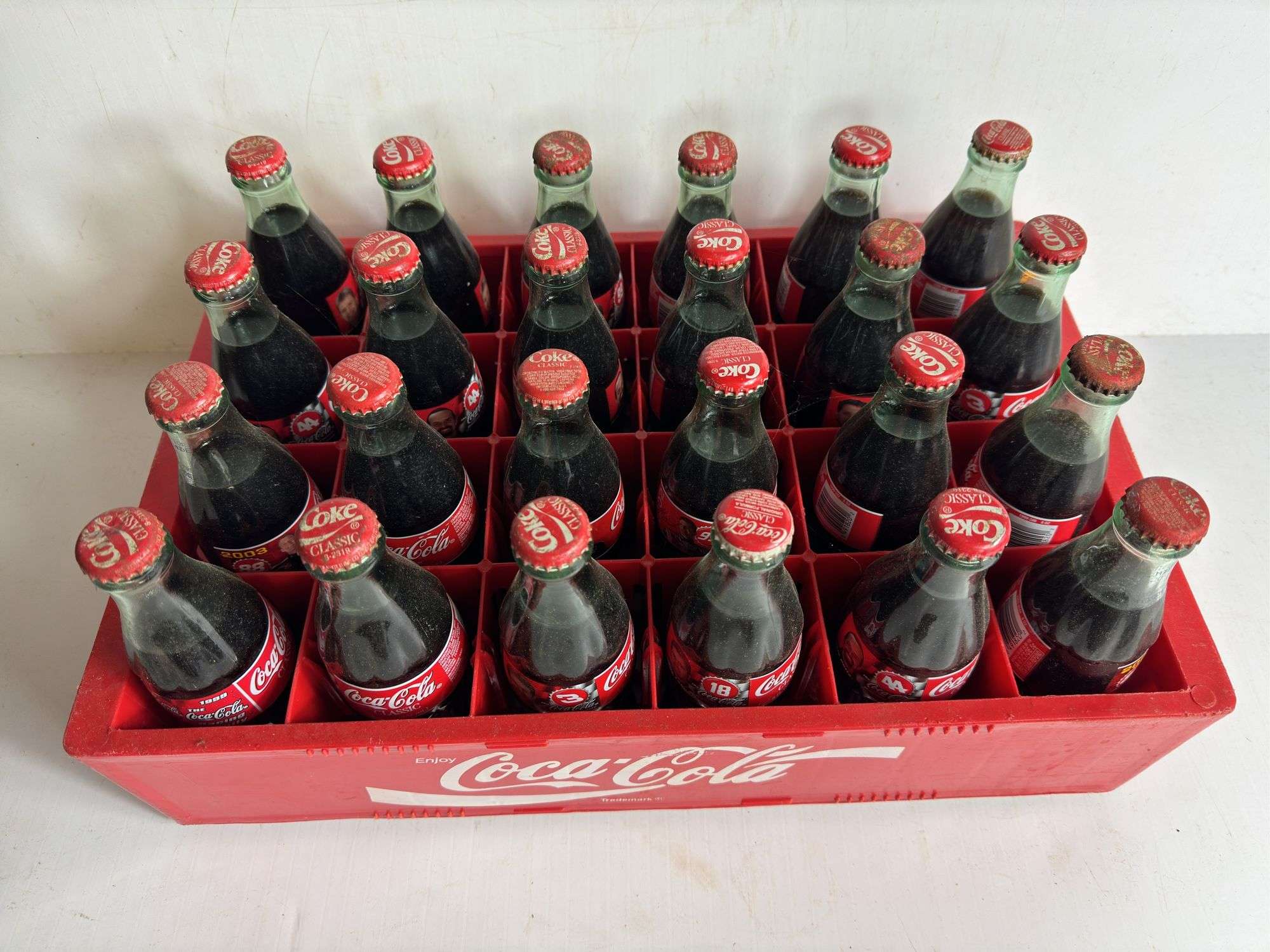 24 Assorted 8oz. Coca Cola Bottles in Plastic Crate - Kaufman
