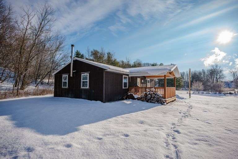 Parcel 1: 7.3 Acres w/ 549’ frontage. Includes a cabin & large pond.