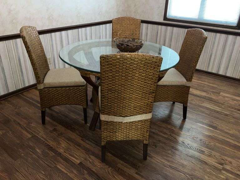 Round wicker table and padded chairs