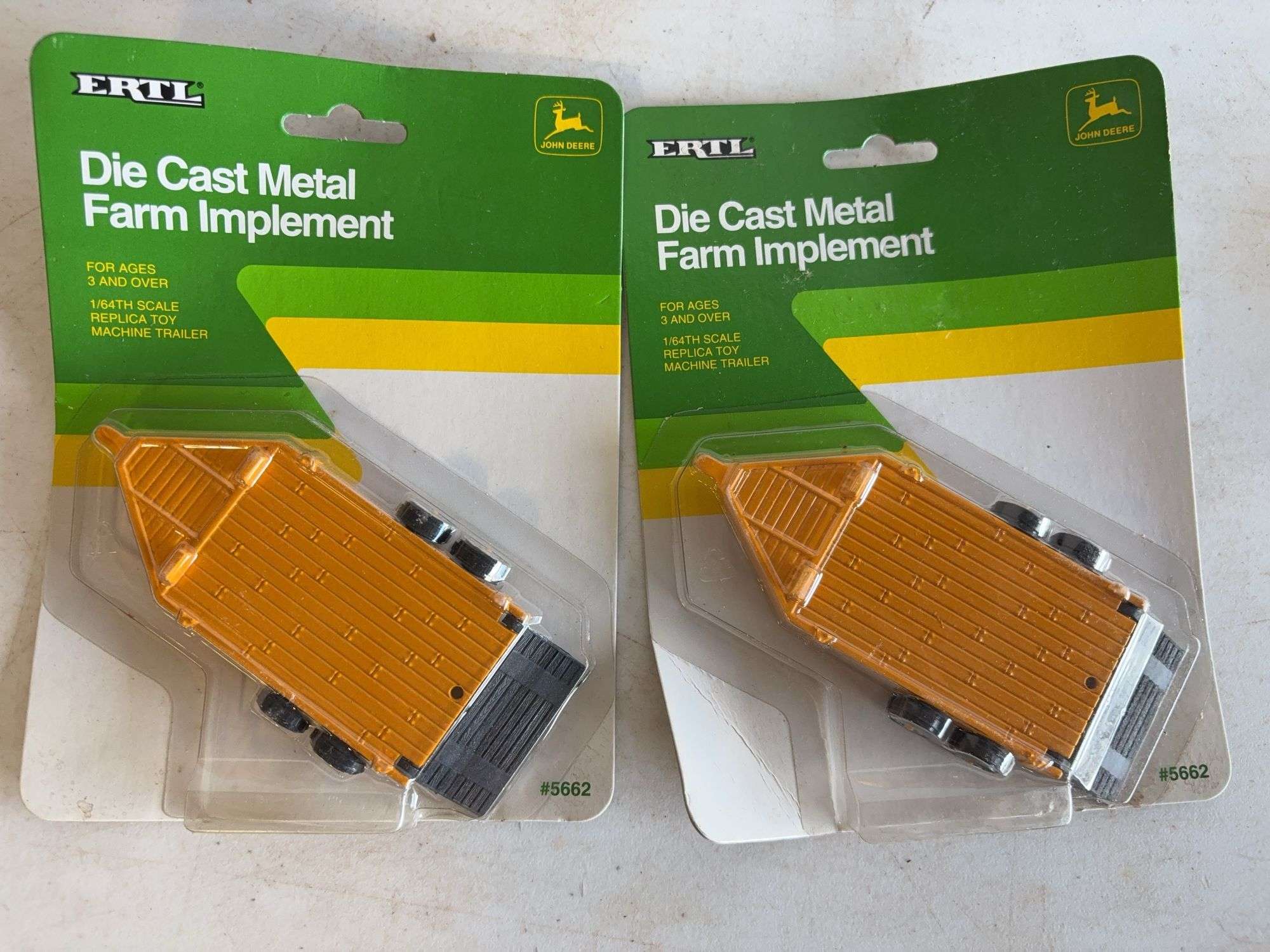 (3) John Deere model tractors, (1) rotary cutter, and (2) implements - 1/64 scale