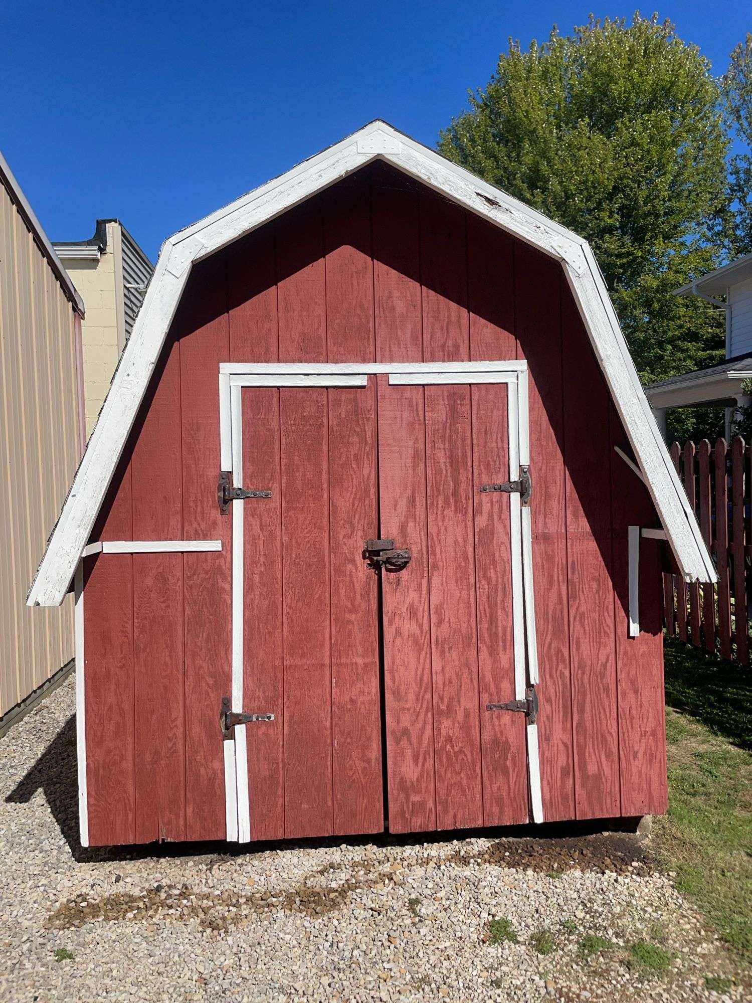 Red and white 8x12 storage barn - contents not included