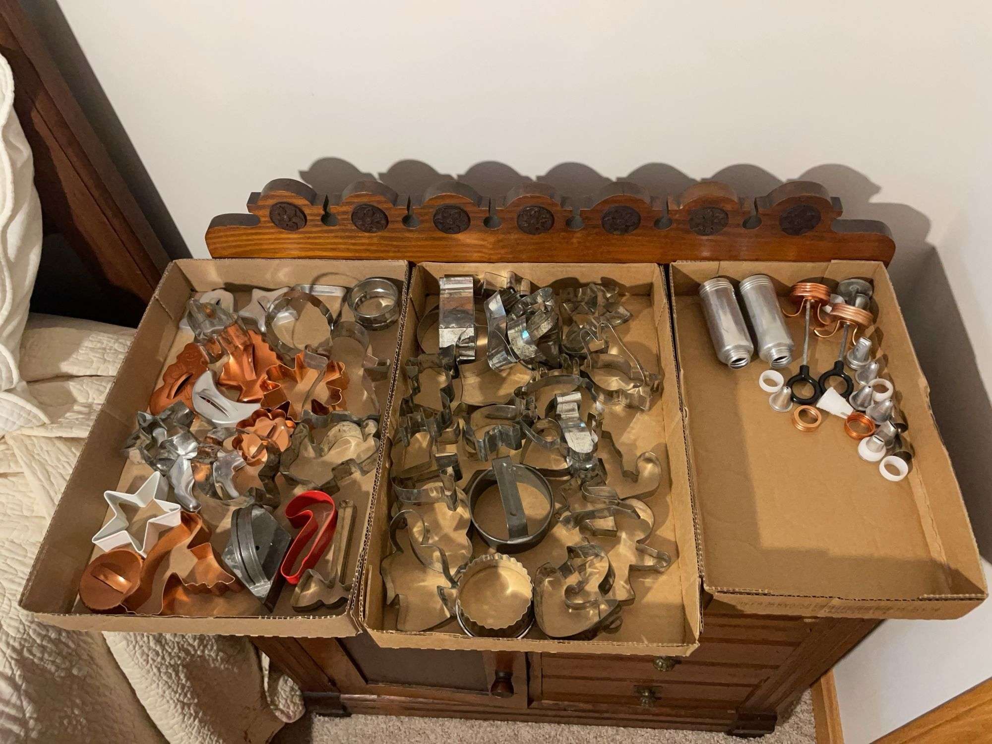 (2) flats of antique cookie cutters and icing dispensers