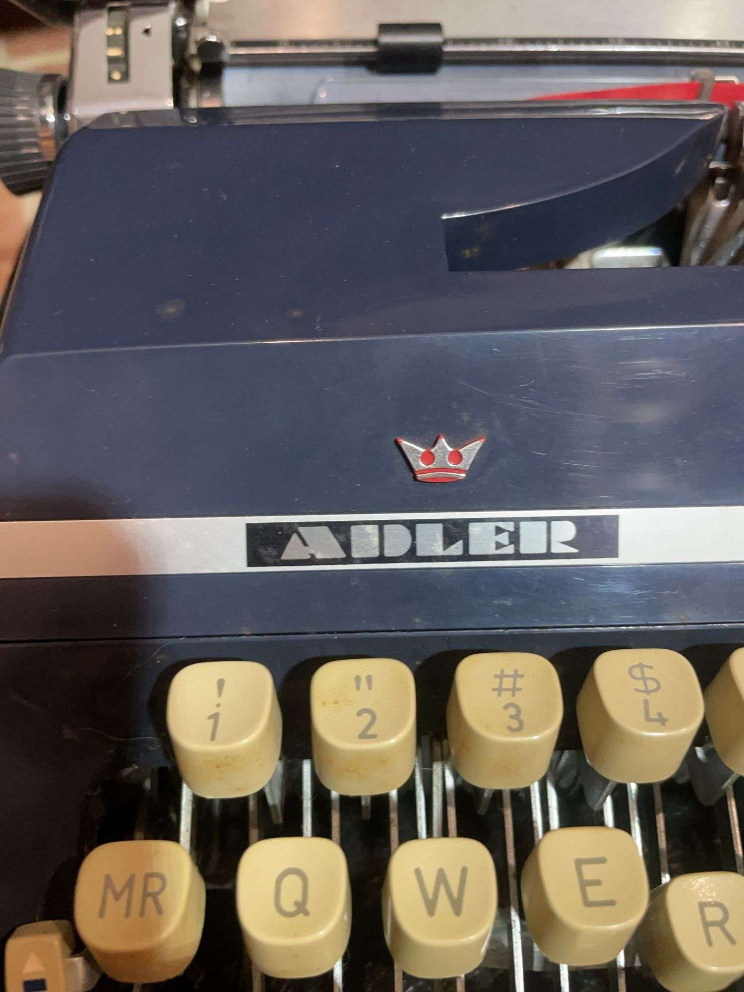 Antique Adler typewriter with case