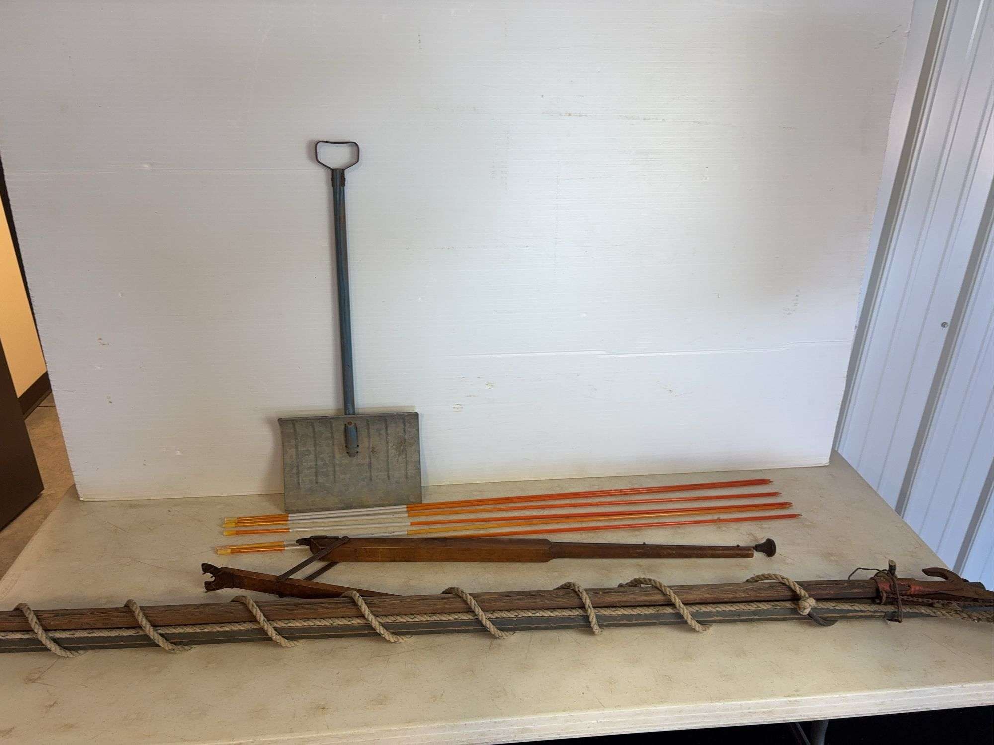 Yard markers, decorative shovel, branch trimmer, and antique piece