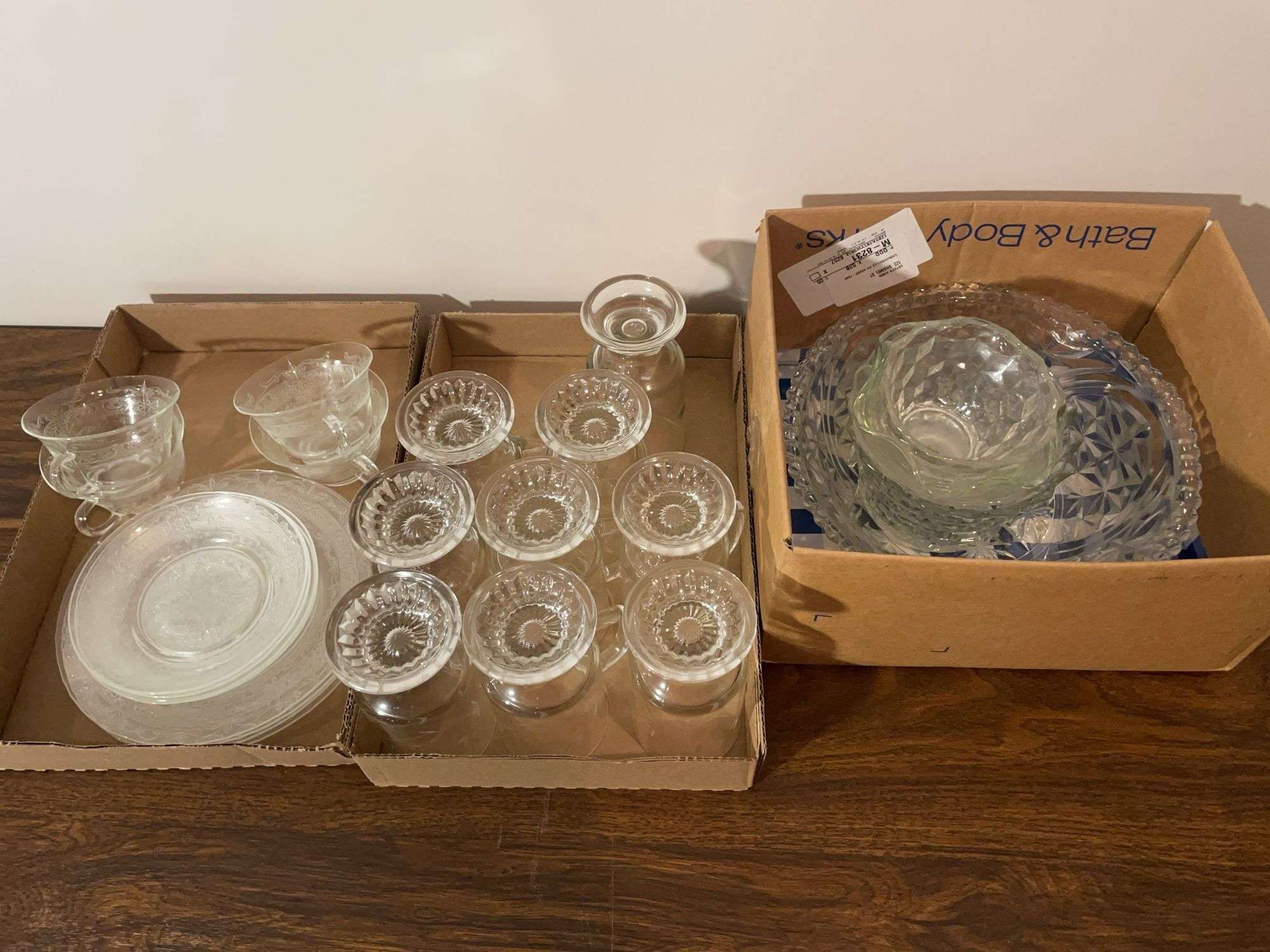 Assortment of clear glassware - cups, dishes, bowls, and more