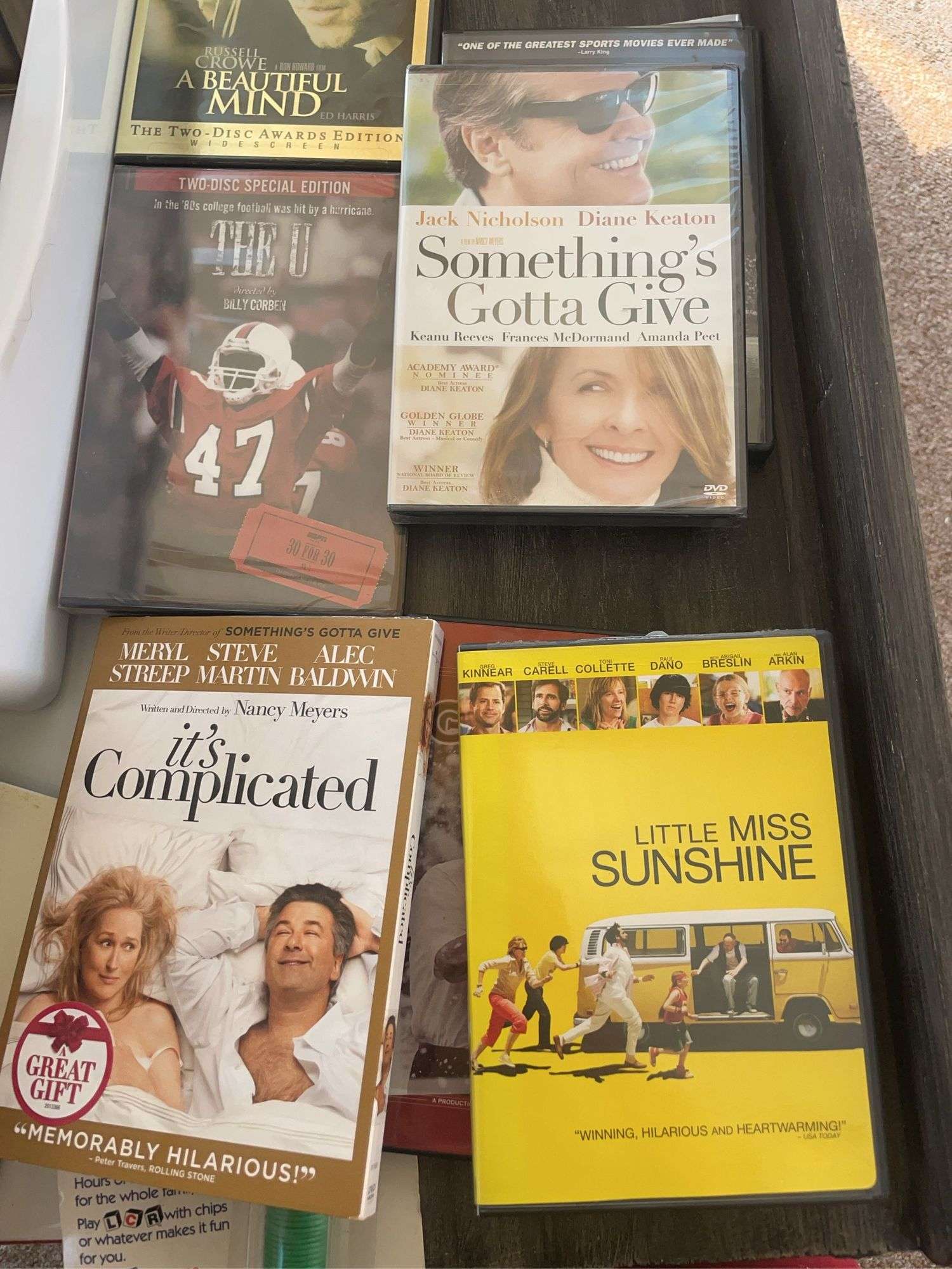 Lot of games & movies including card shuffler, playing cards, LCR & others