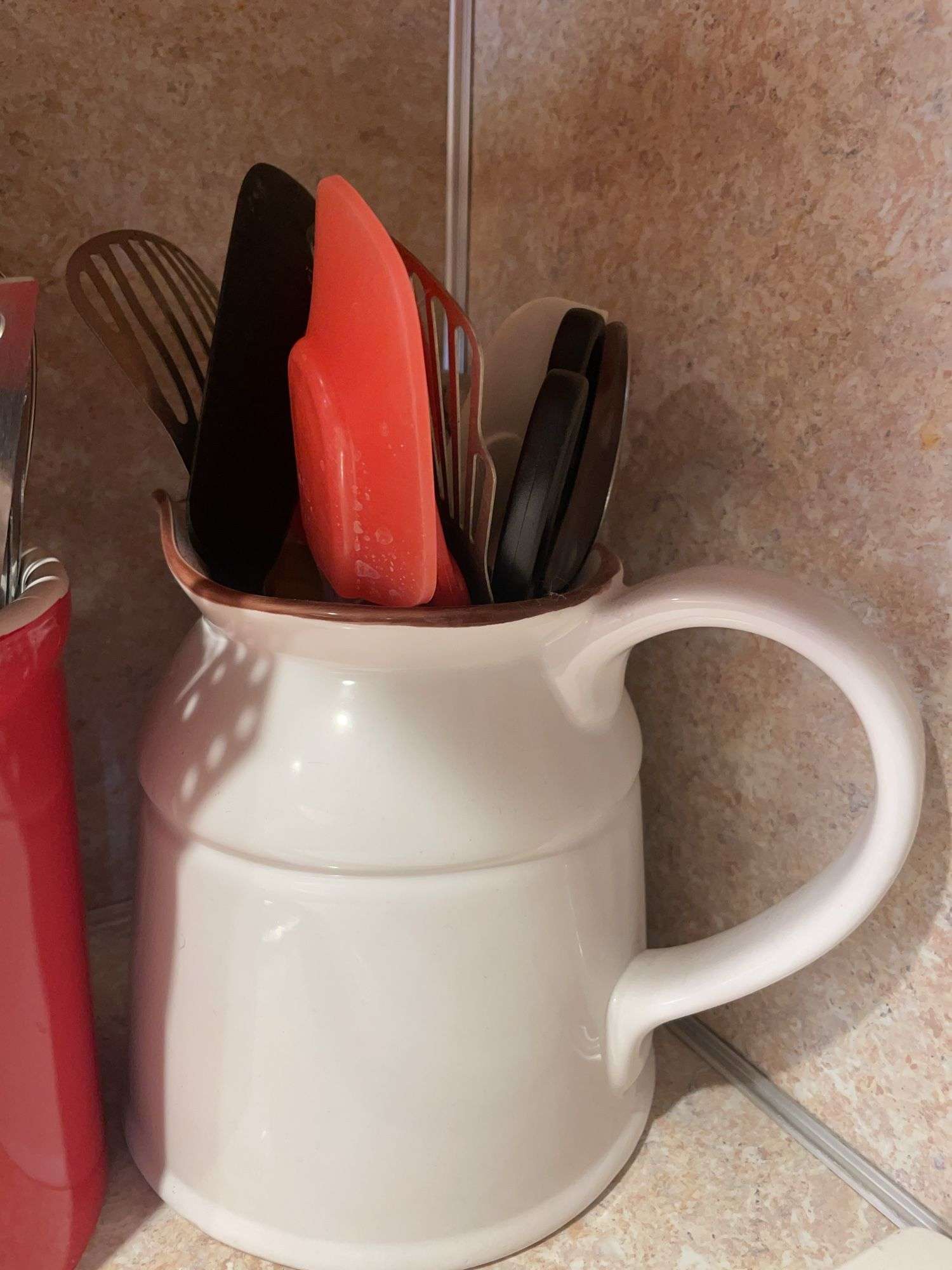Cutting board and crock with miscellaneous kitchen utensils