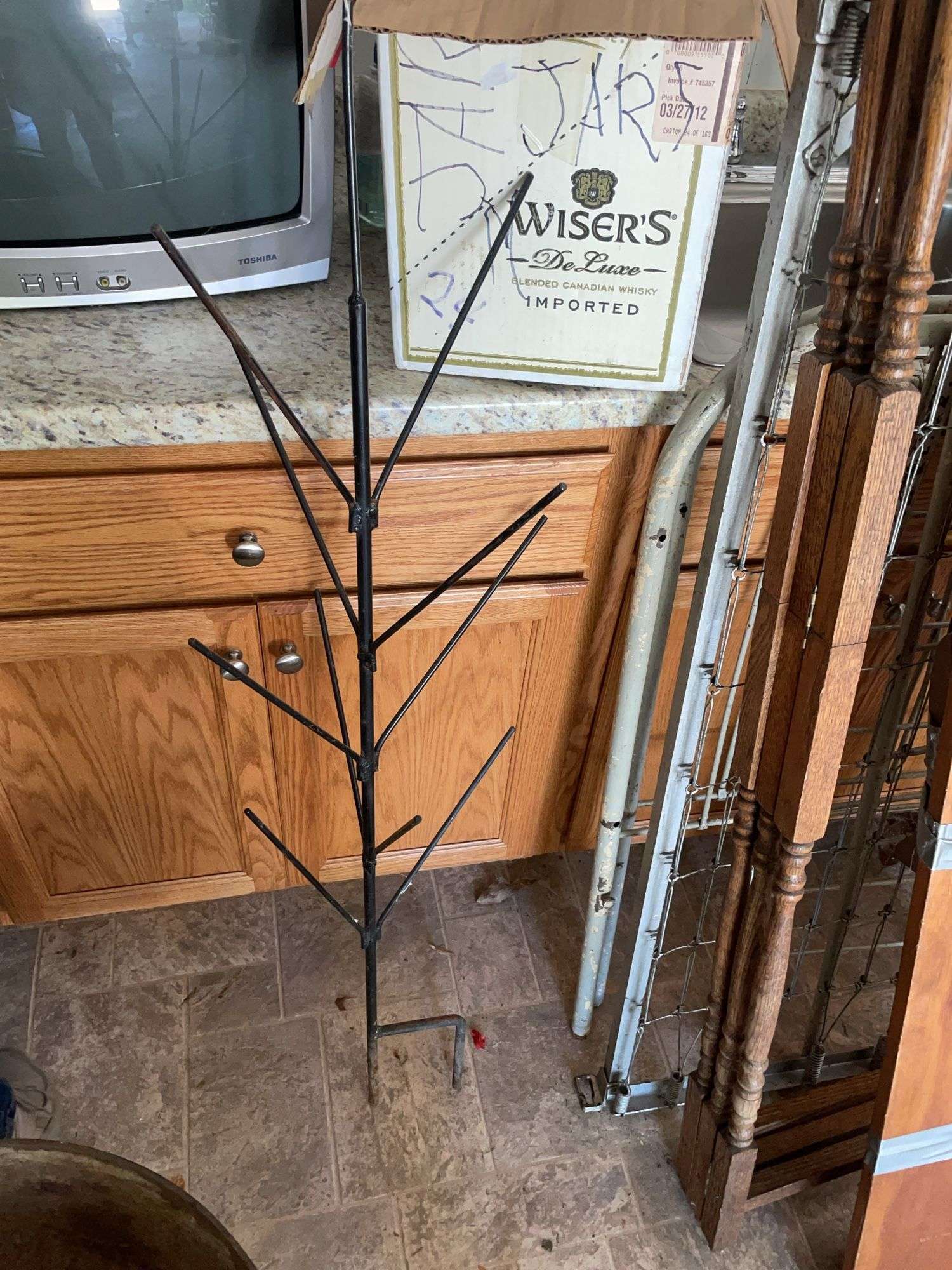 Box of empty wine bottles & decorative rack