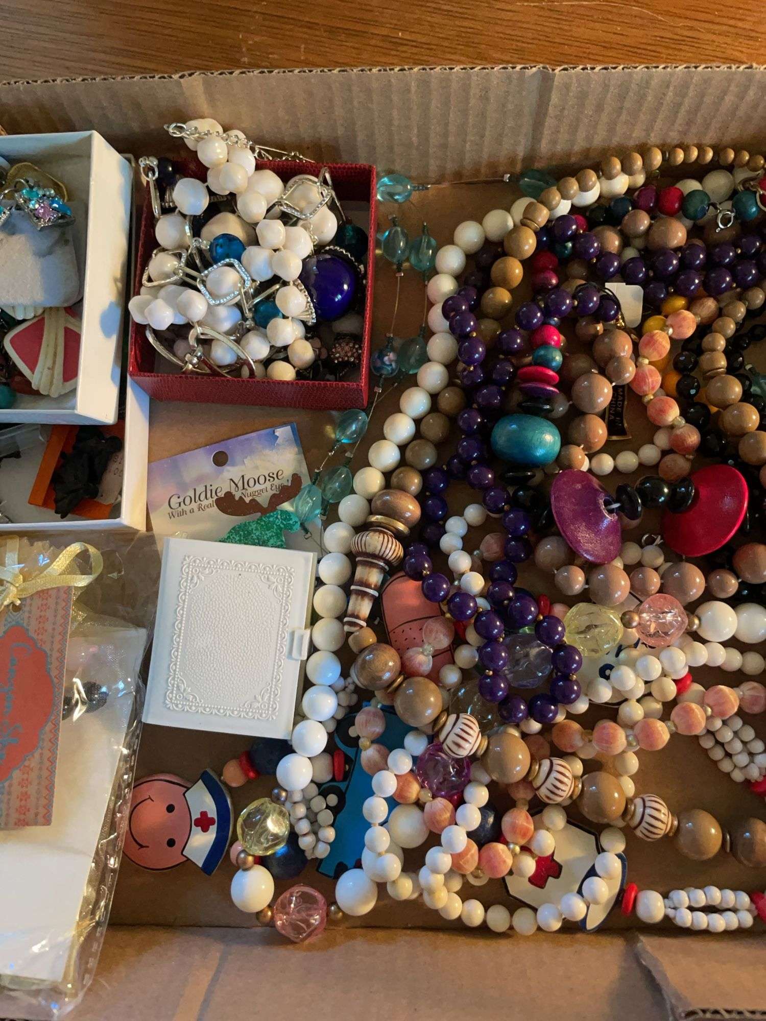 Flat of costume jewelry - mostly necklaces