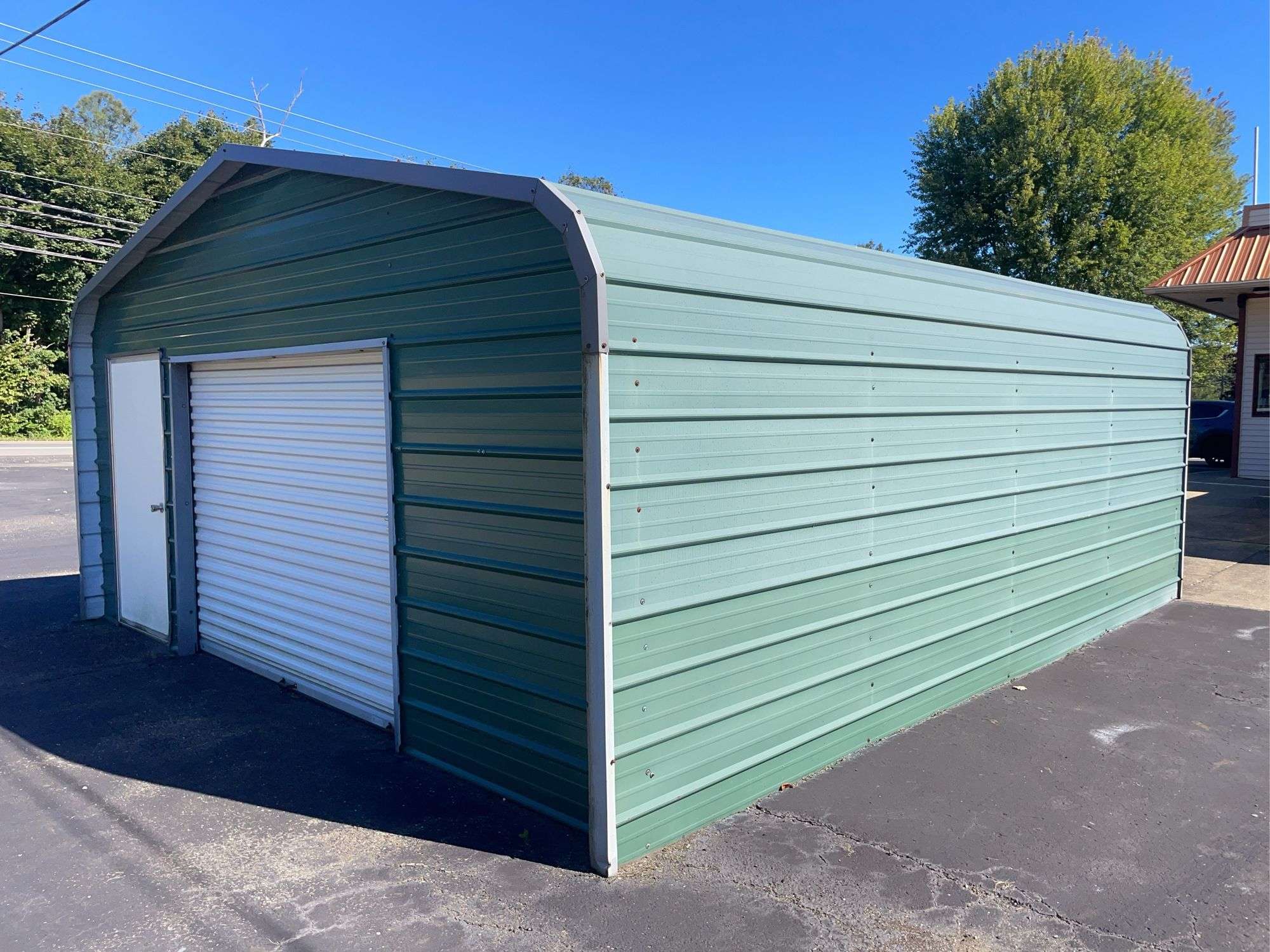 20x21 ft. Green metal Garage - w/ man door & garage door