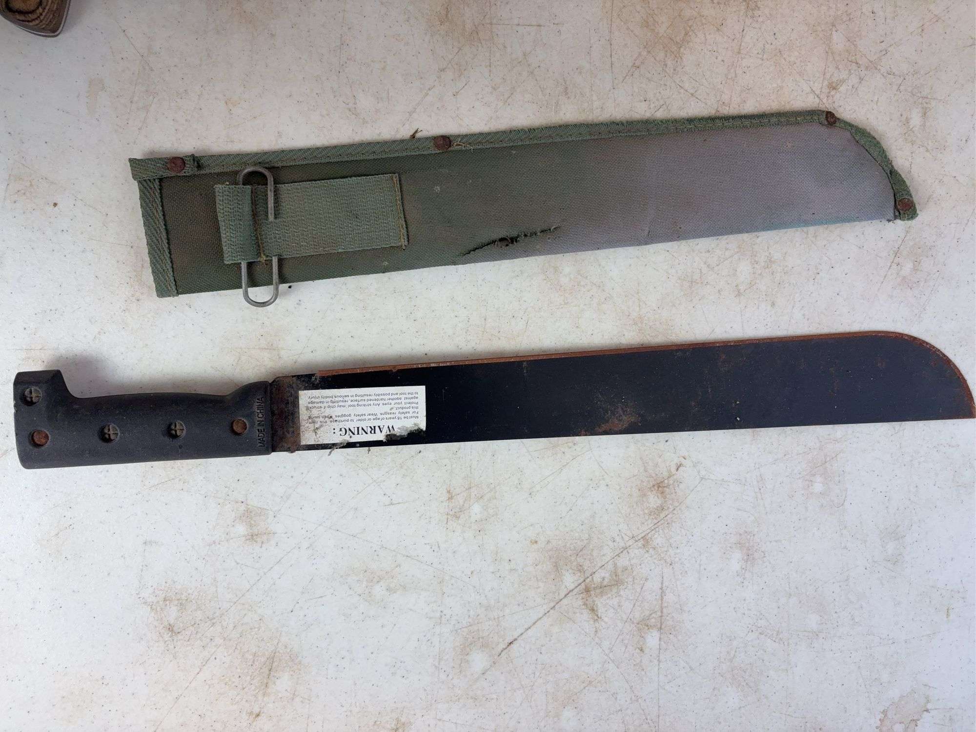 (2) machettes, Cabela's knife, and stainless mesh