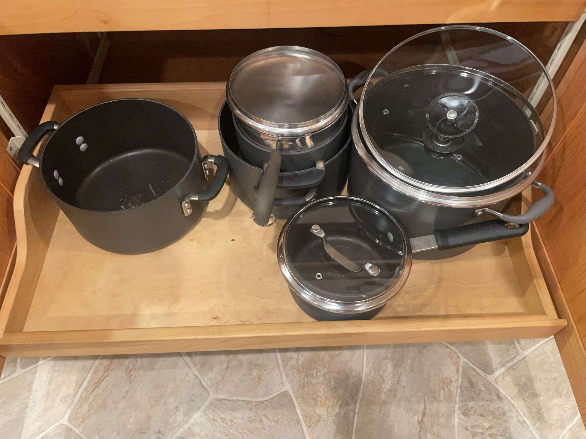 Kitchen drawer w/ mostly pots & lids
