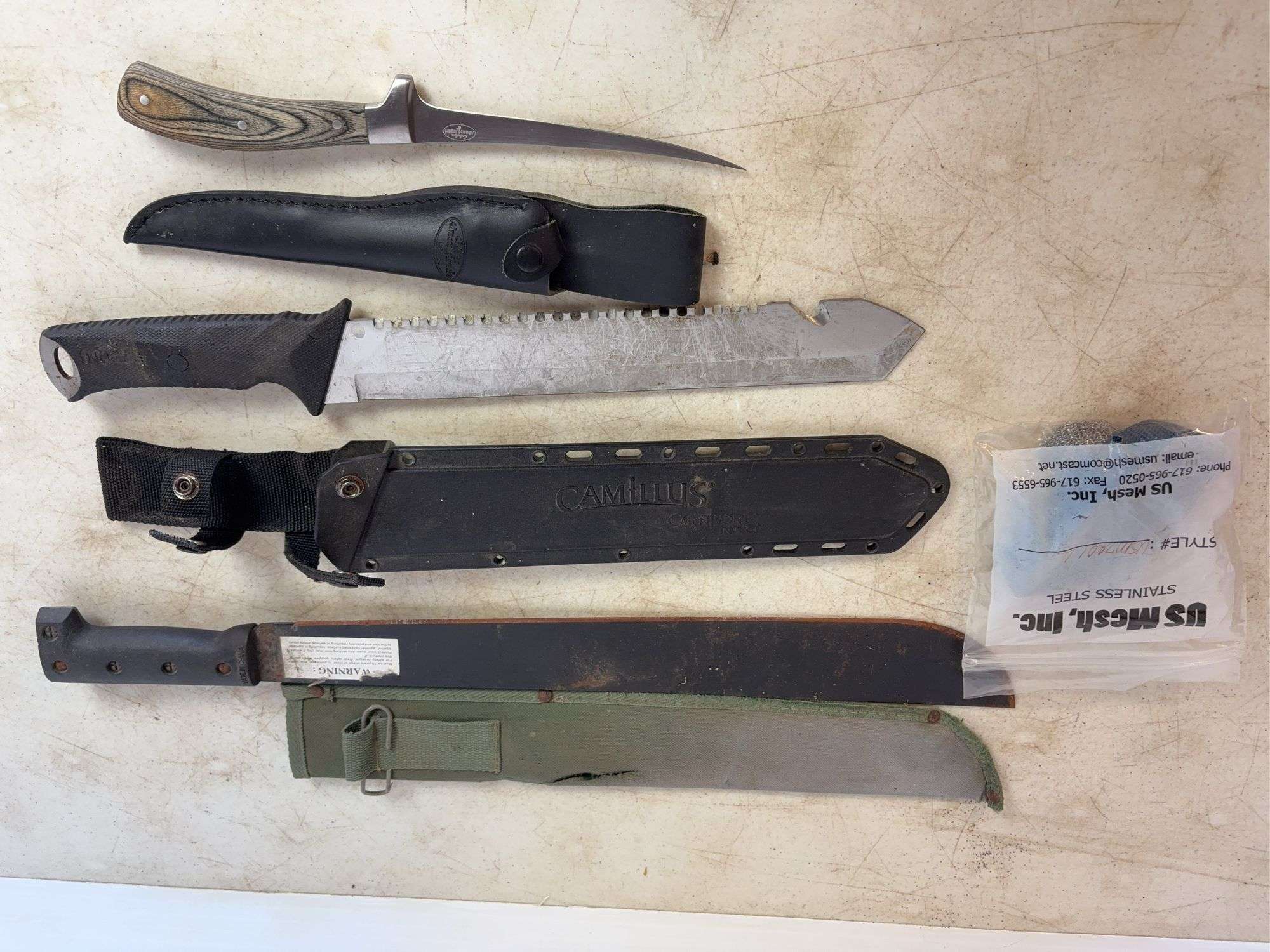 (2) machettes, Cabela's knife, and stainless mesh