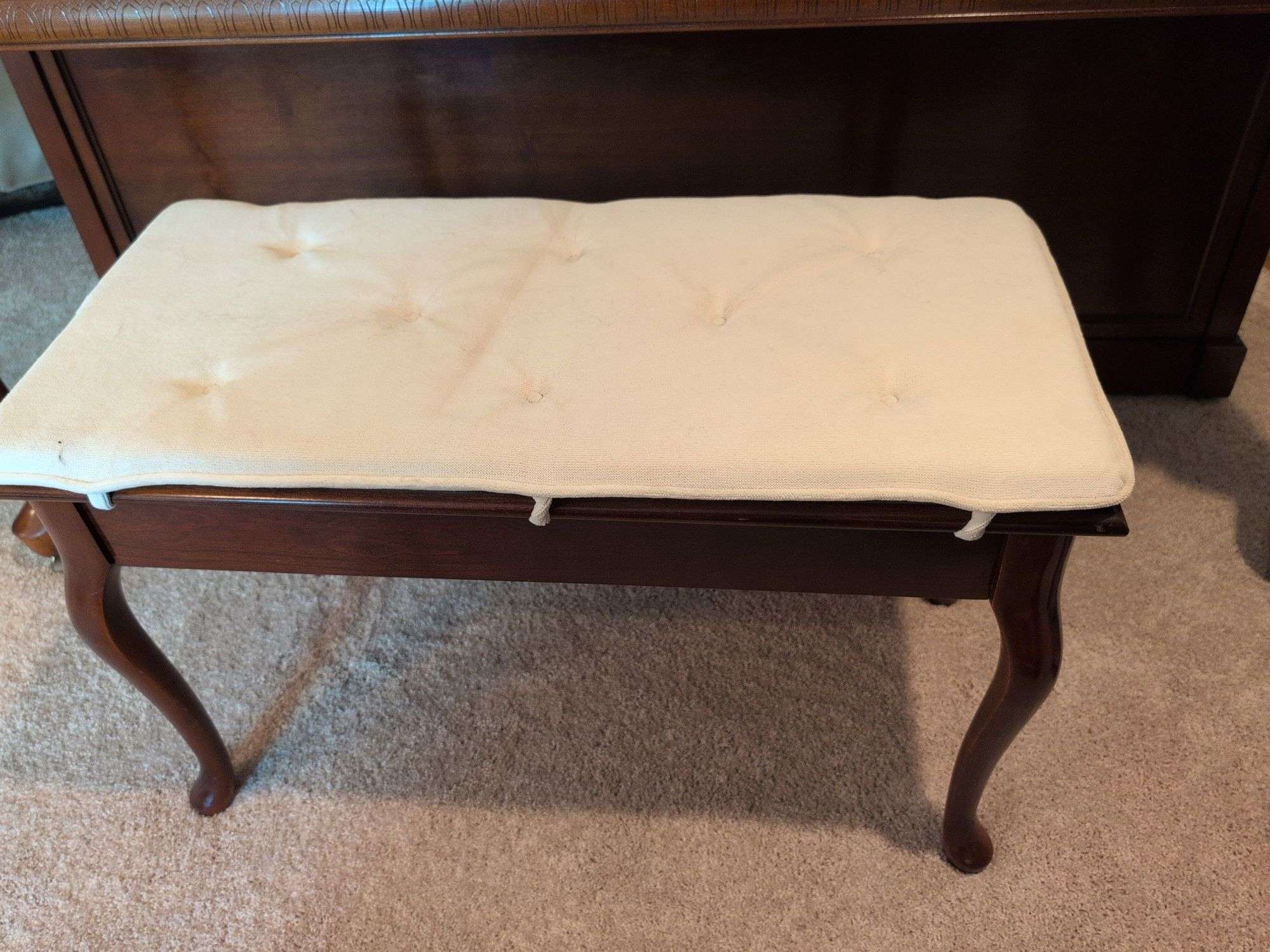 Young piano with bench seat