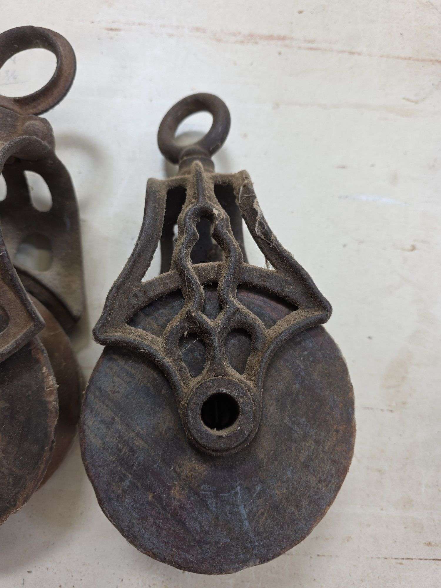 2 wooden pulleys & tongs