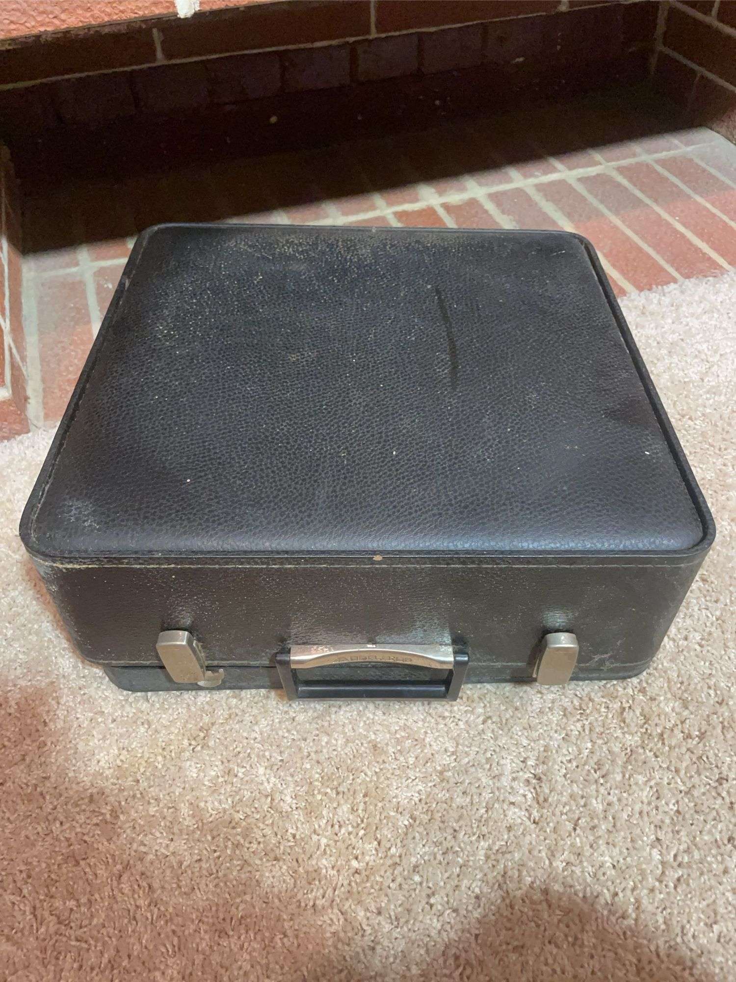 Antique Adler typewriter with case