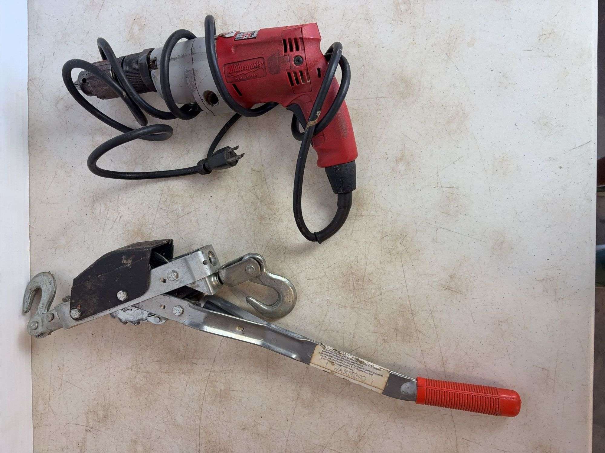 Come-along and Milwaukee hammer drill