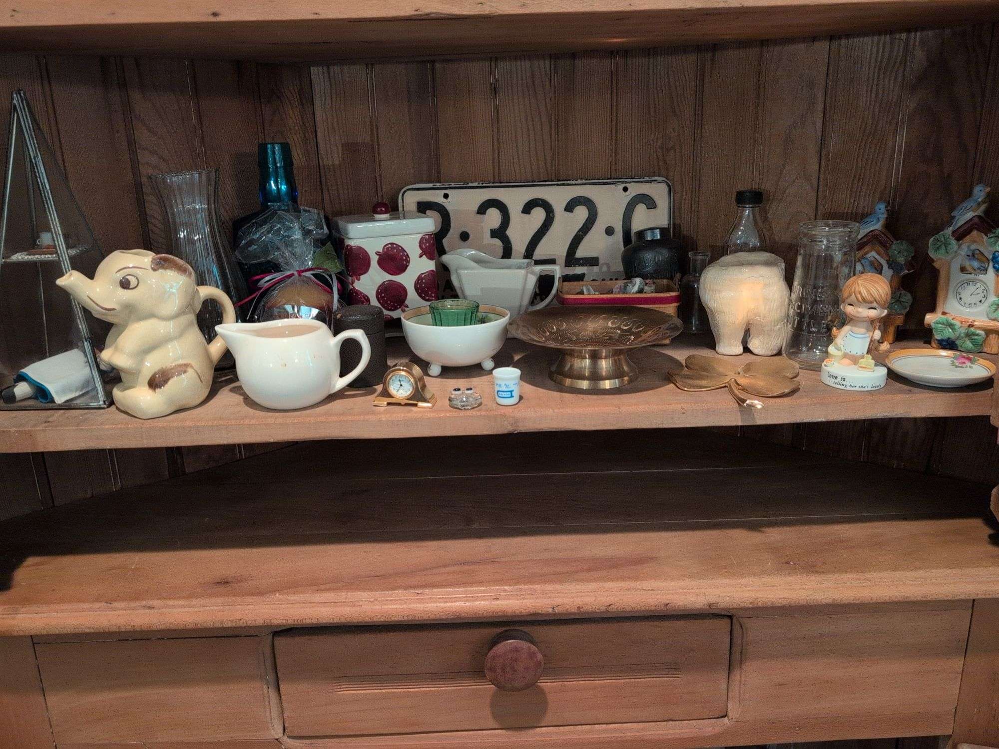 Shelf of decorative glassware pieces