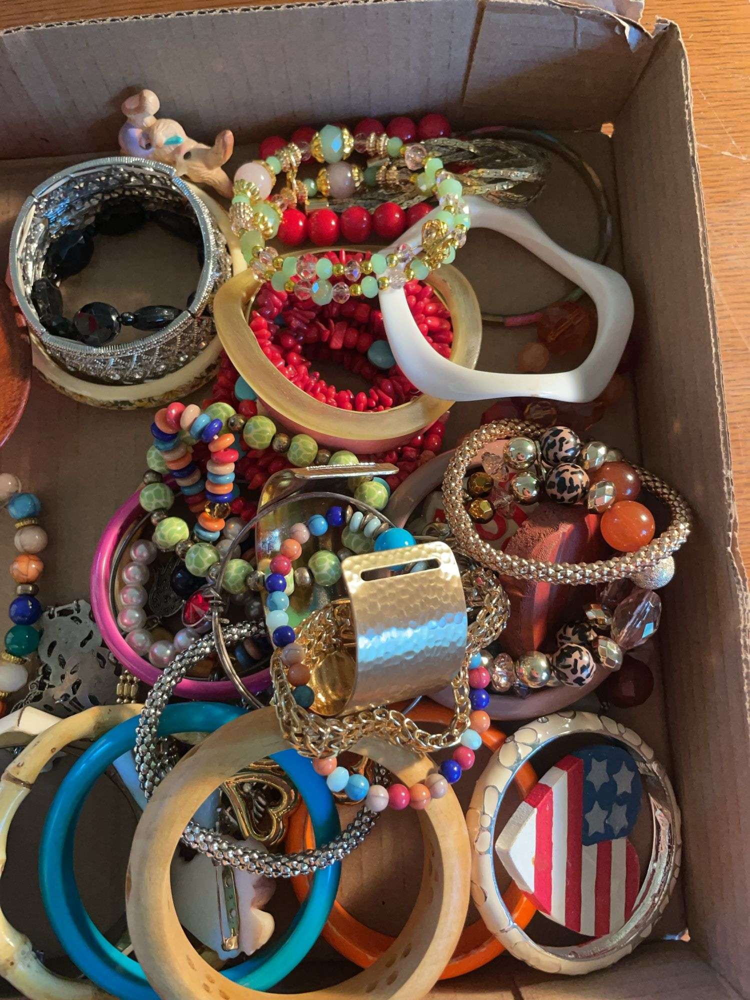Flat of costume jewelry - mostly bracelets