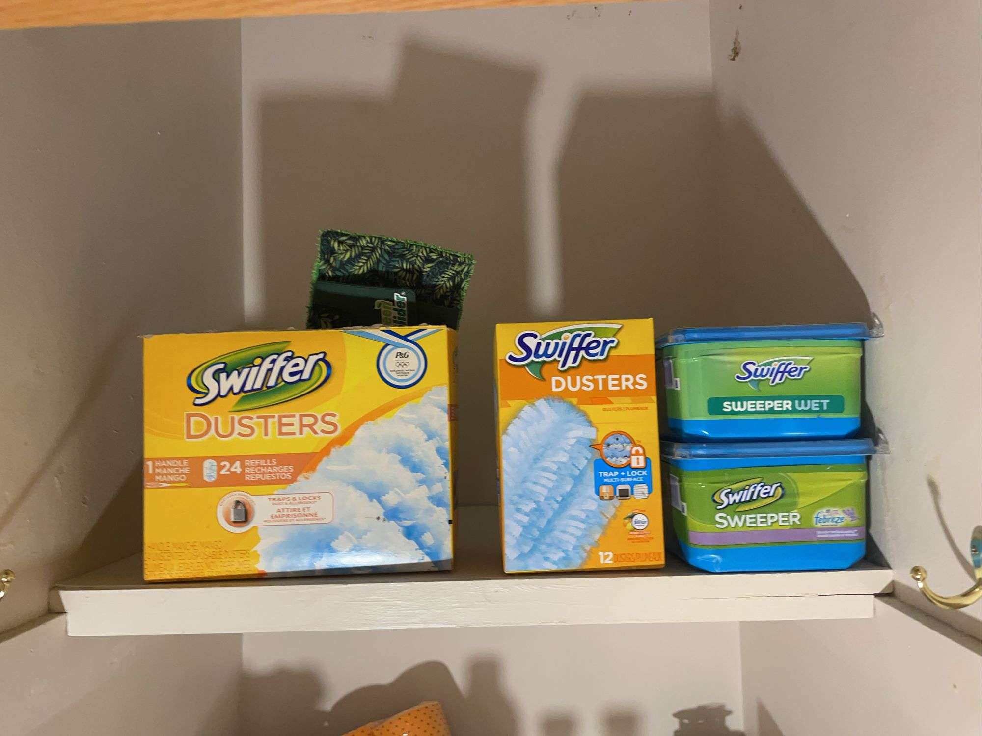 Large assortment of cleaning supplies - Swiffer dusters, spray, and more