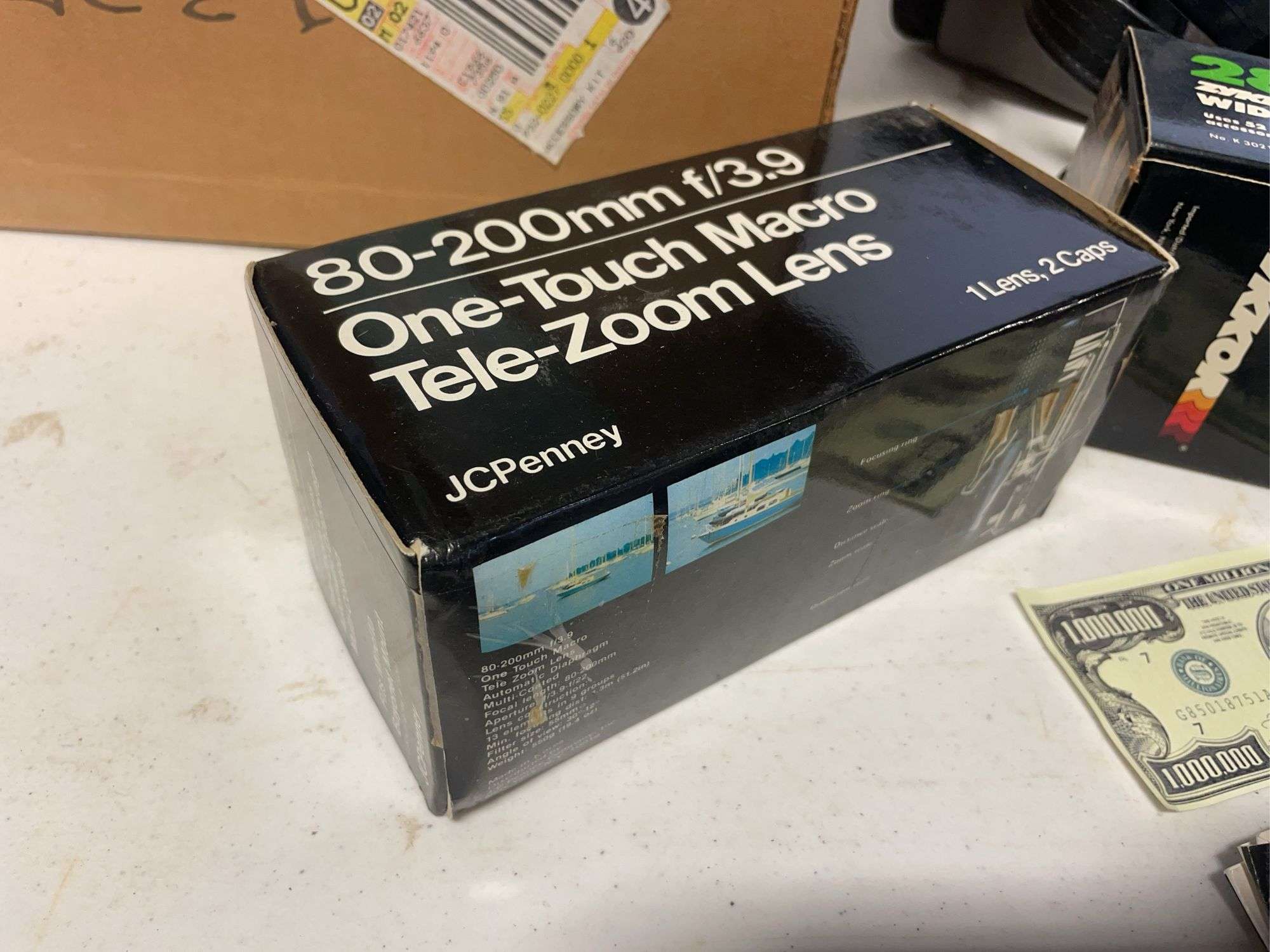 Suitcase, camera with bag, antique General Electric speaker, tin, and more