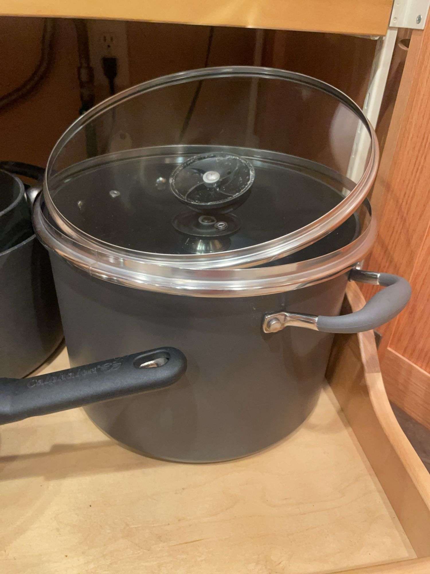 Kitchen drawer w/ mostly pots & lids
