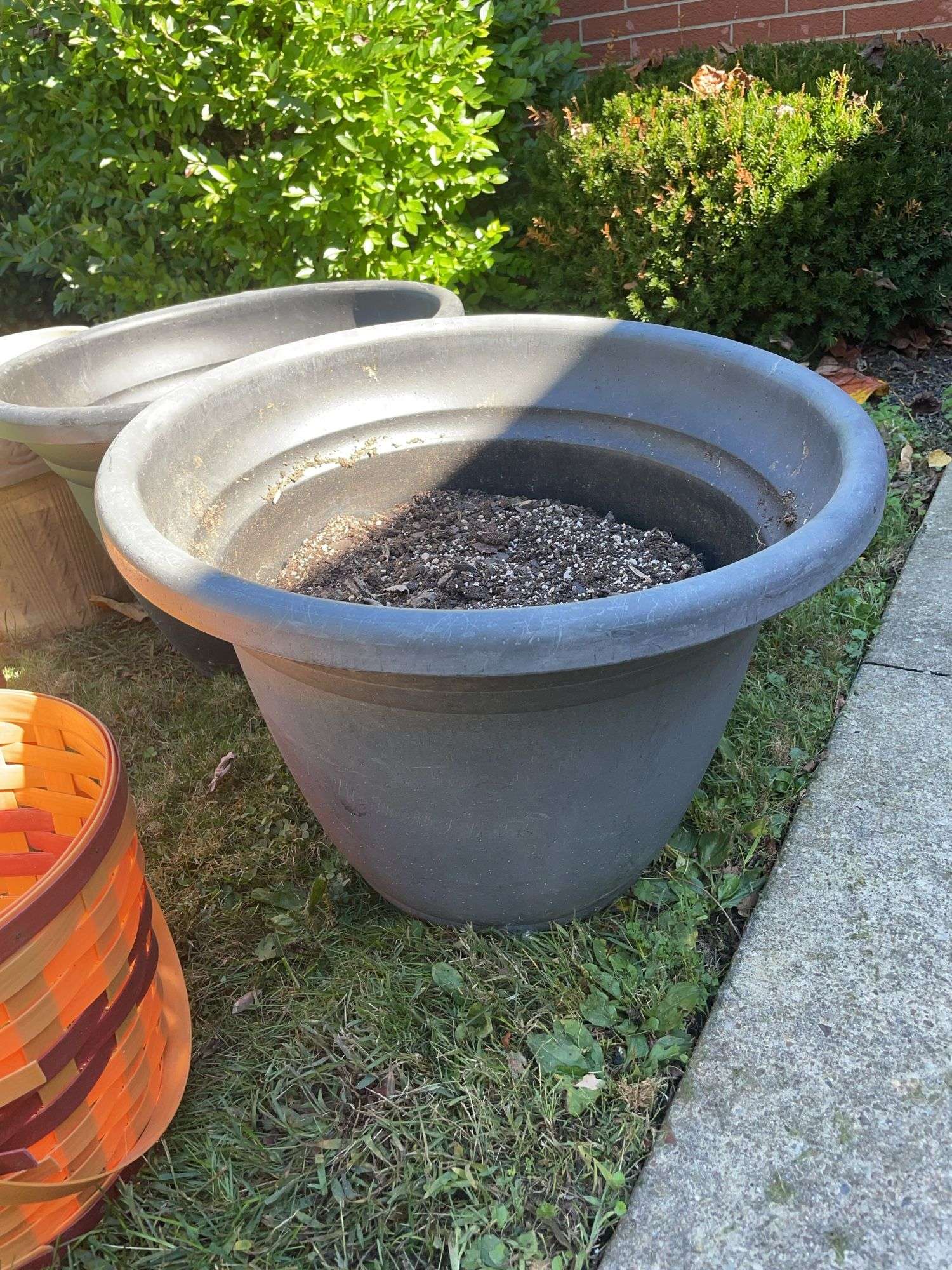 (2) large plastic planters, ceramic planter & decorative basket planter covers