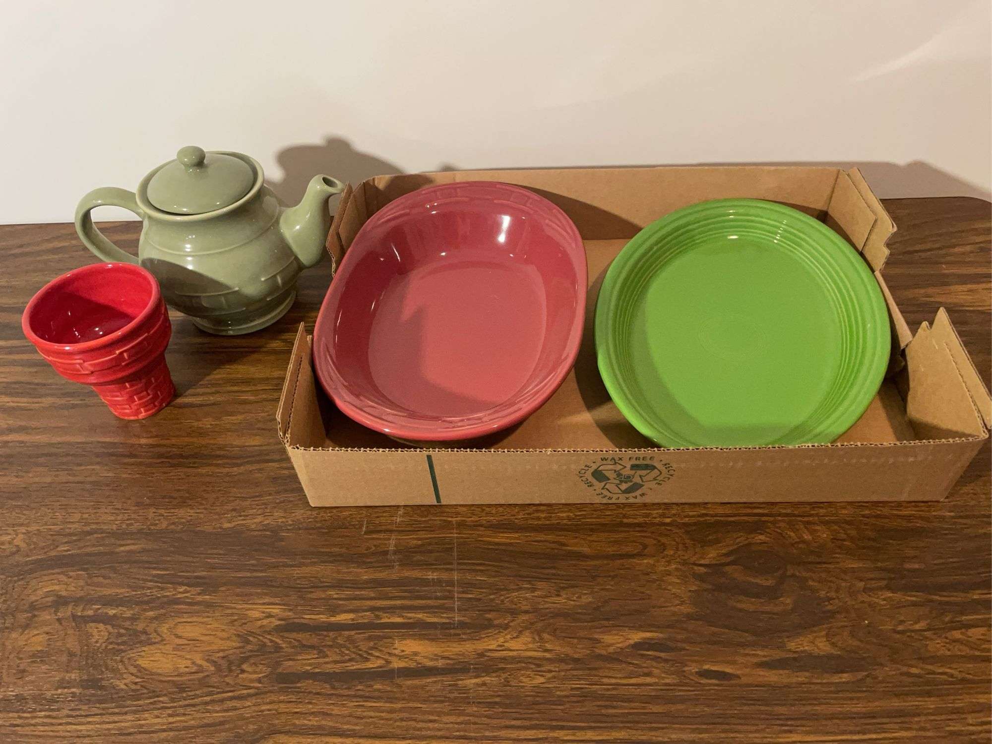 Longaberger teapot, dish, and other piece, and Fiesta dish