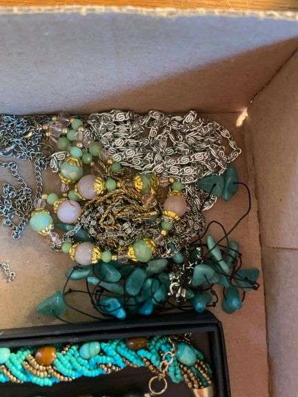 Flat of costume jewelry - mostly necklaces