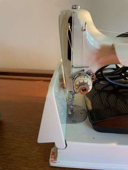 Singer sewing machine with attachments