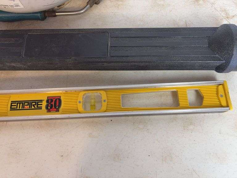 Propane tank with torch, deck sprayer, and level