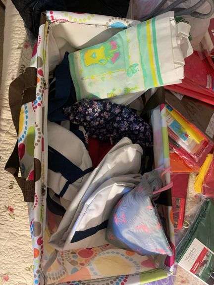 Large assortment of purses, tablecloths, and storage bags