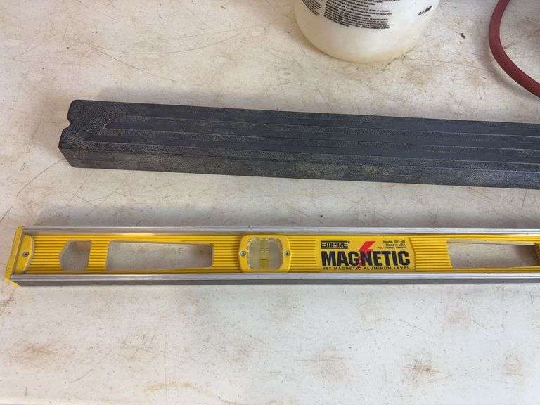 Propane tank with torch, deck sprayer, and level